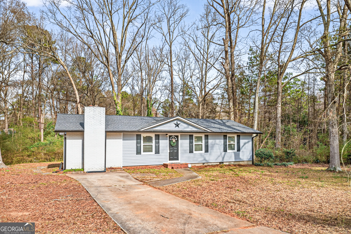 11 Johnston Road Griffin, GA 30224 - Photo 29 of 46 a front view of a house with a yard