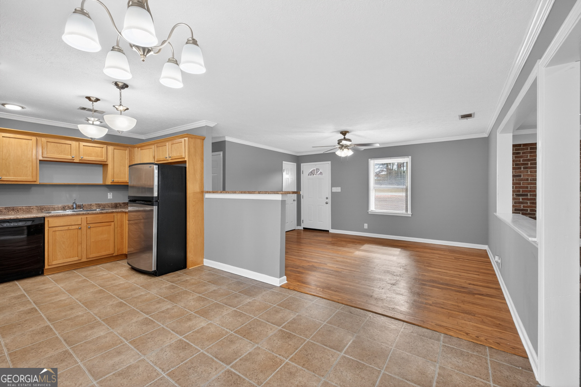 11 Johnston Road Griffin, GA 30224 - Photo 6 of 46 a view of a kitchen with a stove cabinets and a kitchen