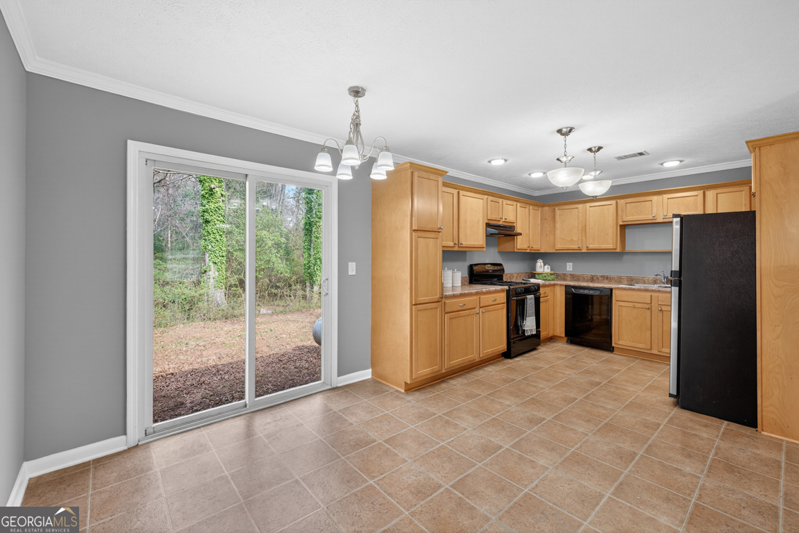11 Johnston Road Griffin, GA 30224 - Photo 7 of 46 a kitchen with stainless steel appliances granite countertop a refrigerator and a sink