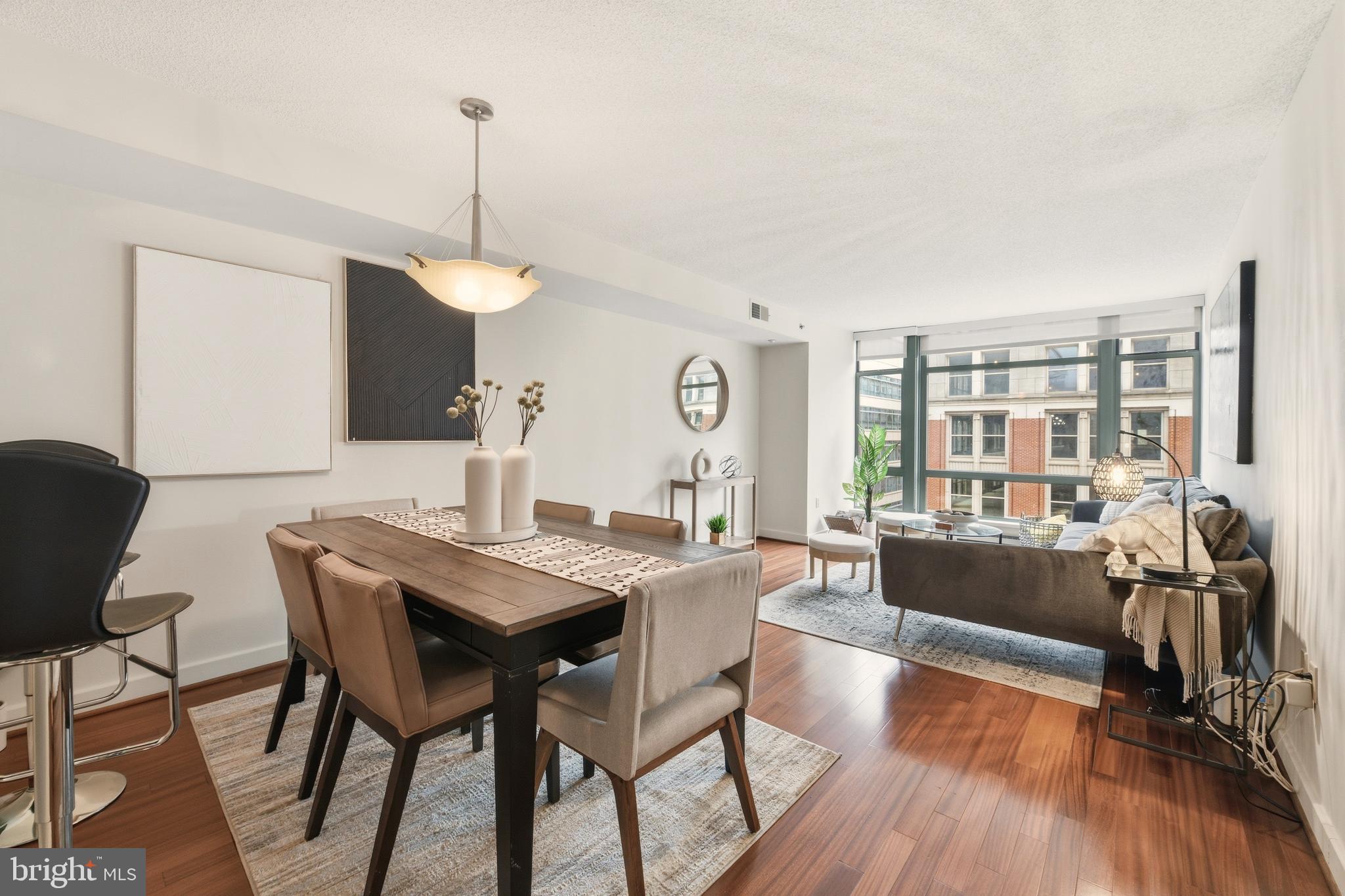 1150 K Street Northwest, Unit 1109 Washington, DC 20005 - Photo 5 of 33 a view of a dining room with furniture window and wooden floor