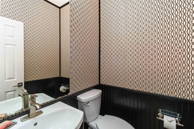 a bathroom with a sink and a toilet