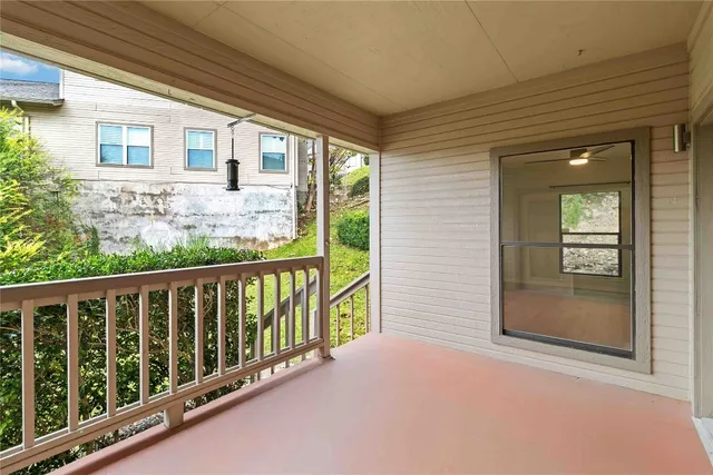 a view of a balcony with wooden floor