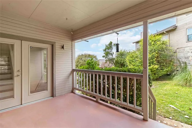 a view of a porch with wooden floor and outdoor space