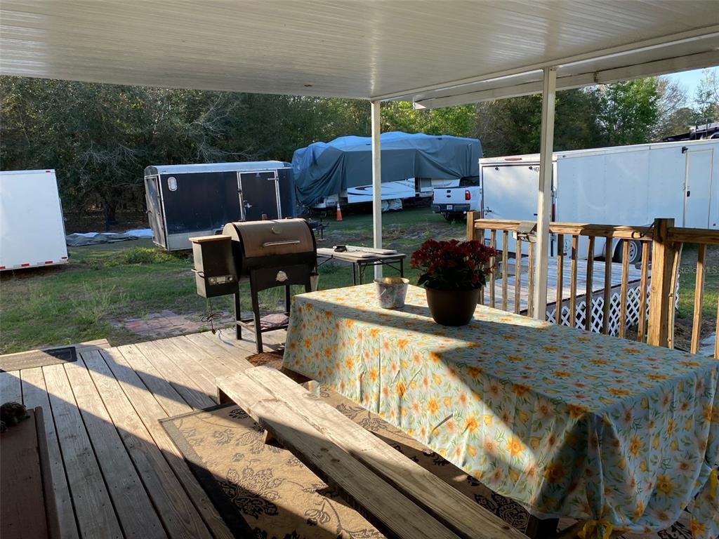 31244 Tyndall Road Zephyrhills, FL 33545 - Photo 11 of 24 a view of a deck with furniture