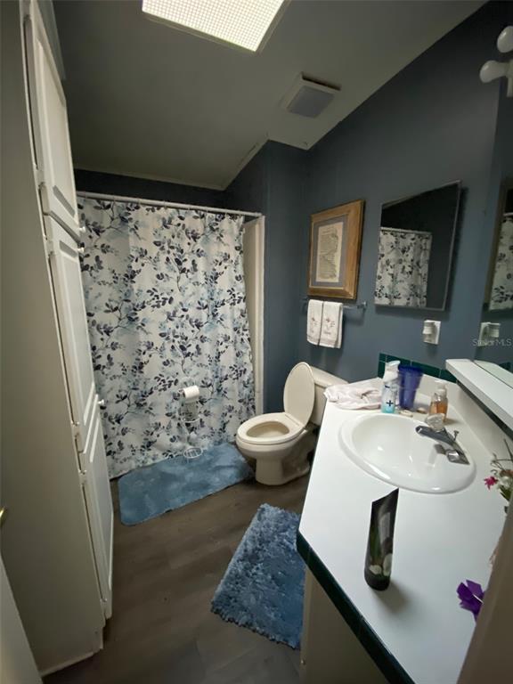 31244 Tyndall Road Zephyrhills, FL 33545 - Photo 9 of 24 a bathroom with a sink toilet and shower