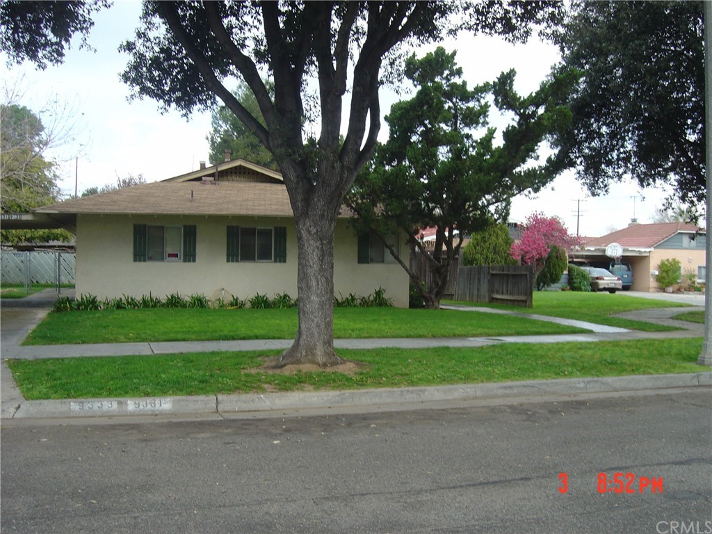 9331 Sage Avenue Riverside, CA 92503 - Photo 1 of 1 a front view of house with yard and green space