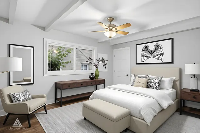 a bedroom with a bed and a couch