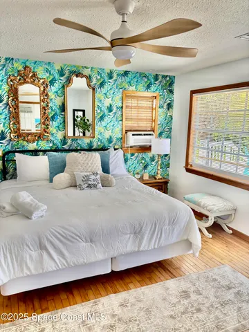 a view of a patio with a table and chairs