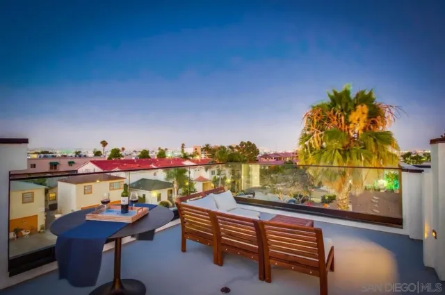 a front view of a house with a yard and tree s