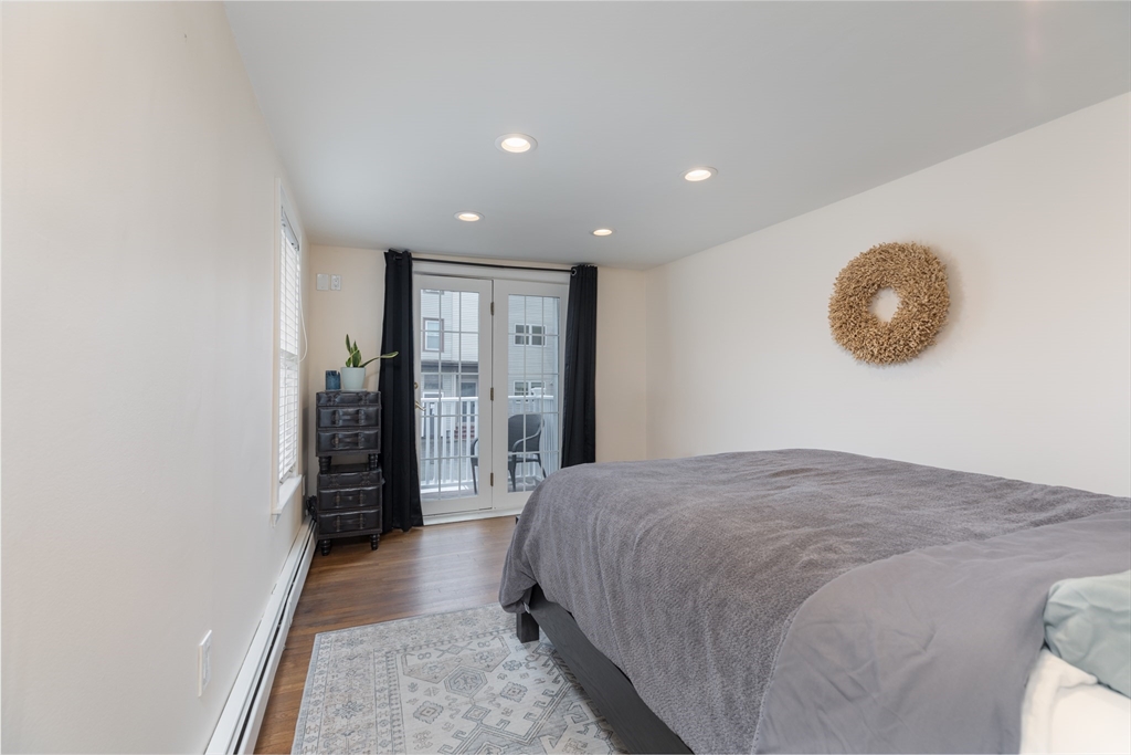 571 East 3rd Street Boston, MA 02127 - Photo 12 of 20 a spacious bedroom with a bed and a walk in closet