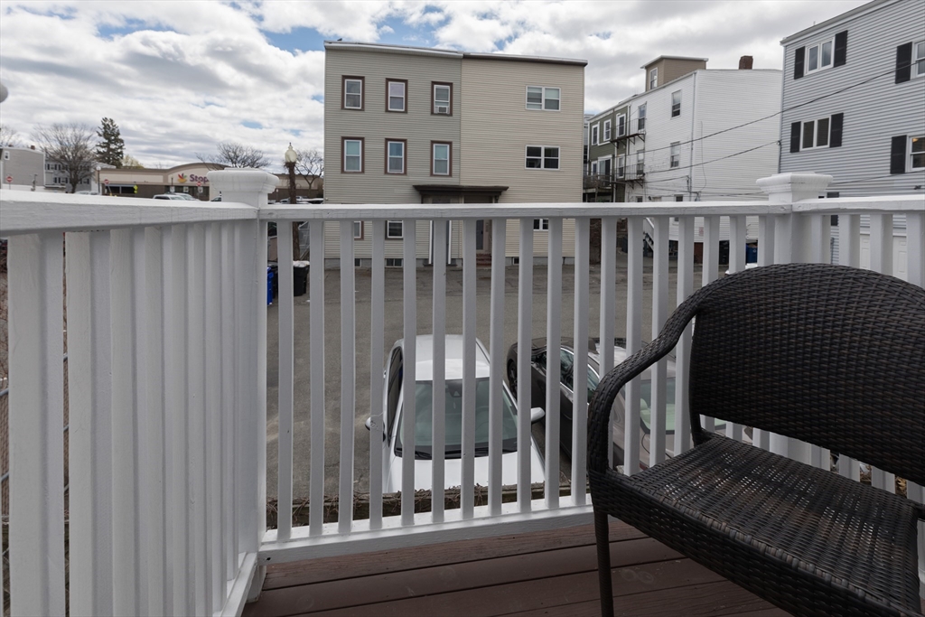 571 East 3rd Street Boston, MA 02127 - Photo 13 of 20 a view of a balcony with two chairs and a deck