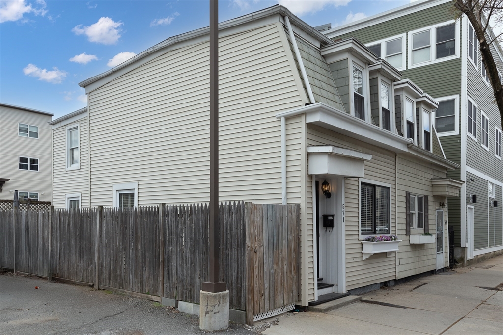 571 East 3rd Street Boston, MA 02127 - Photo 18 of 20 a view of a house with a door and wooden walls