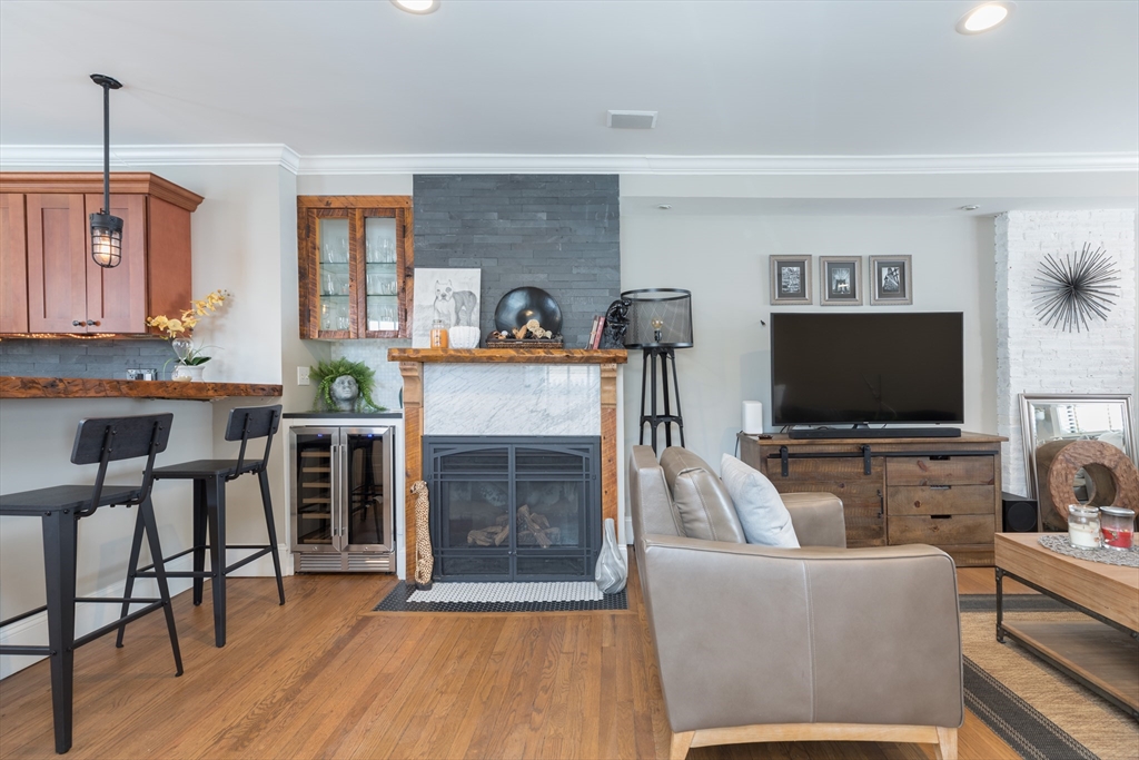 571 East 3rd Street Boston, MA 02127 - Photo 7 of 20 a living room with furniture and a flat screen tv