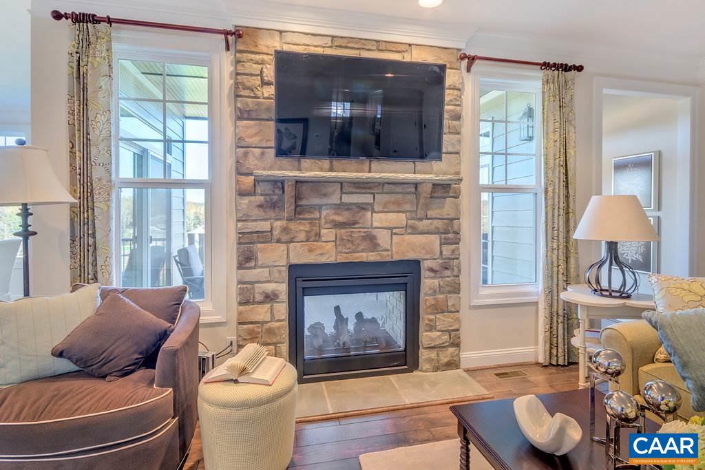 189 Timber Ridge Lane Zion Crossroads, VA 22942 - Photo 8 of 40 a living room with furniture and a fireplace