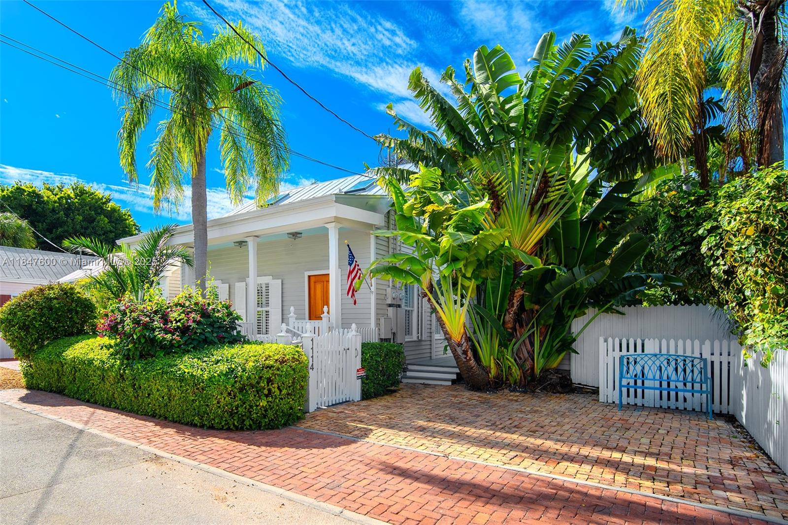 1114 Packer Street Key West, FL 33040 - Photo 11 of 98 a front view of a house with garden