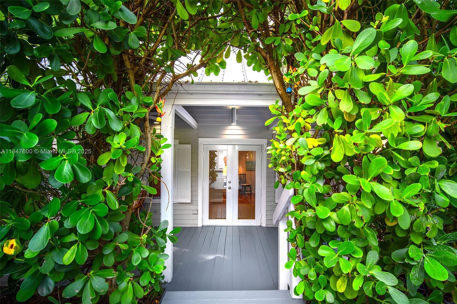 1114 Packer Street Key West, FL 33040 - Photo 21 of 98 a front view of a house with a garden