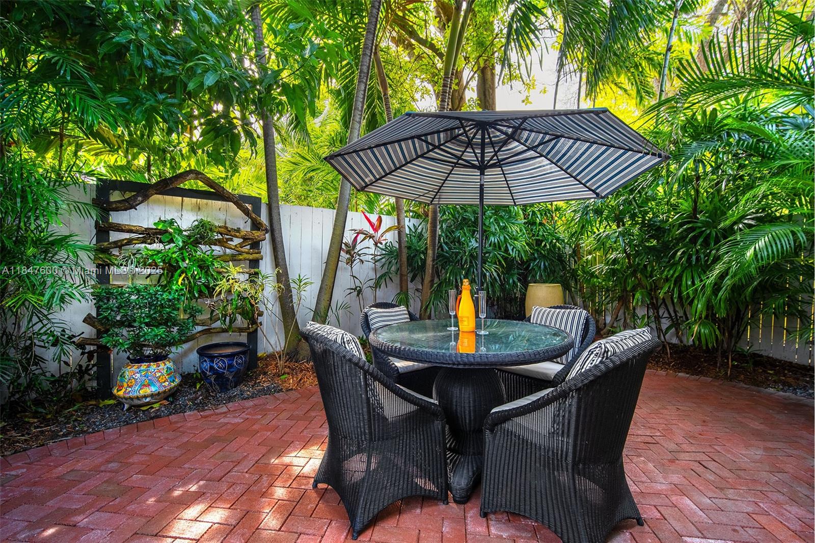 1114 Packer Street Key West, FL 33040 - Photo 23 of 98 a view of patio with furniture and umbrella