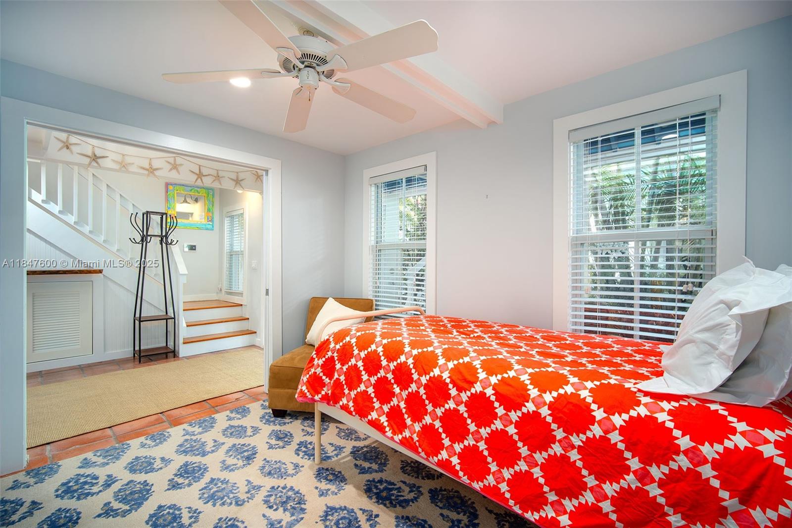 1114 Packer Street Key West, FL 33040 - Photo 26 of 98 a bedroom with a bed and a chandelier
