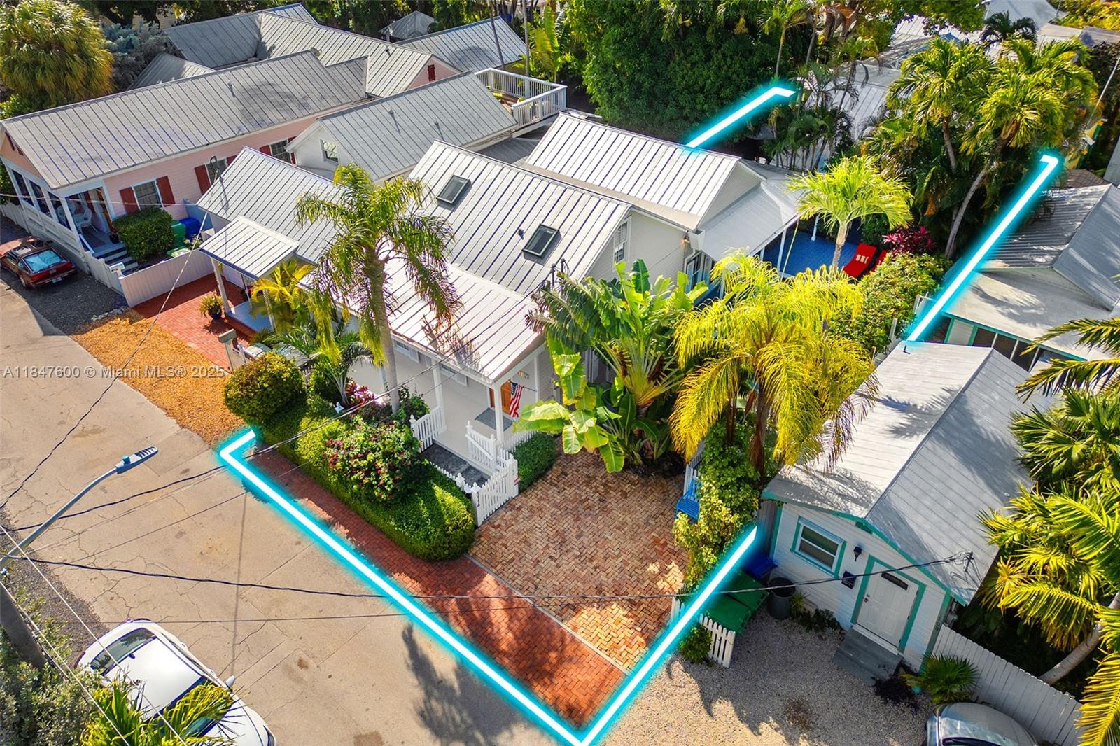 1114 Packer Street Key West, FL 33040 - Photo 4 of 98 an aerial view of a house with a yard and garden