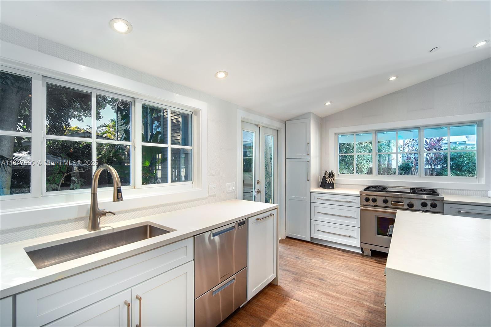 1114 Packer Street Key West, FL 33040 - Photo 43 of 98 a kitchen with a stove and a sink