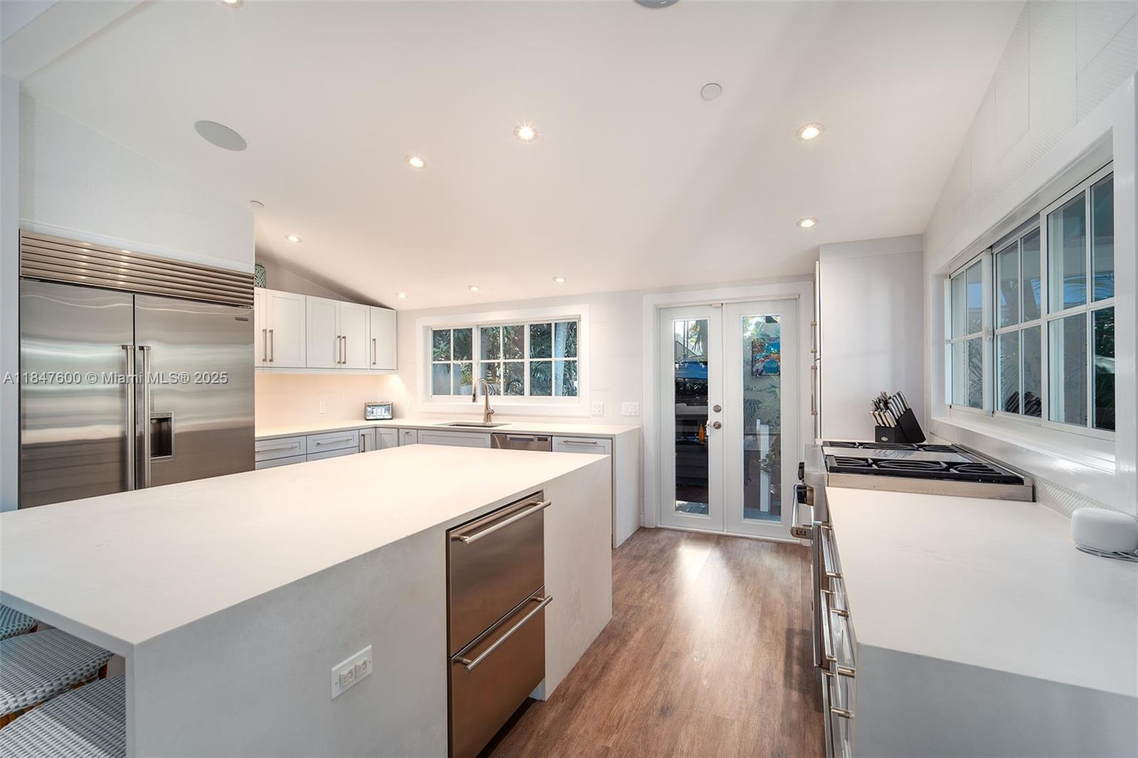 1114 Packer Street Key West, FL 33040 - Photo 45 of 98 a kitchen with stainless steel appliances a sink stove and refrigerator