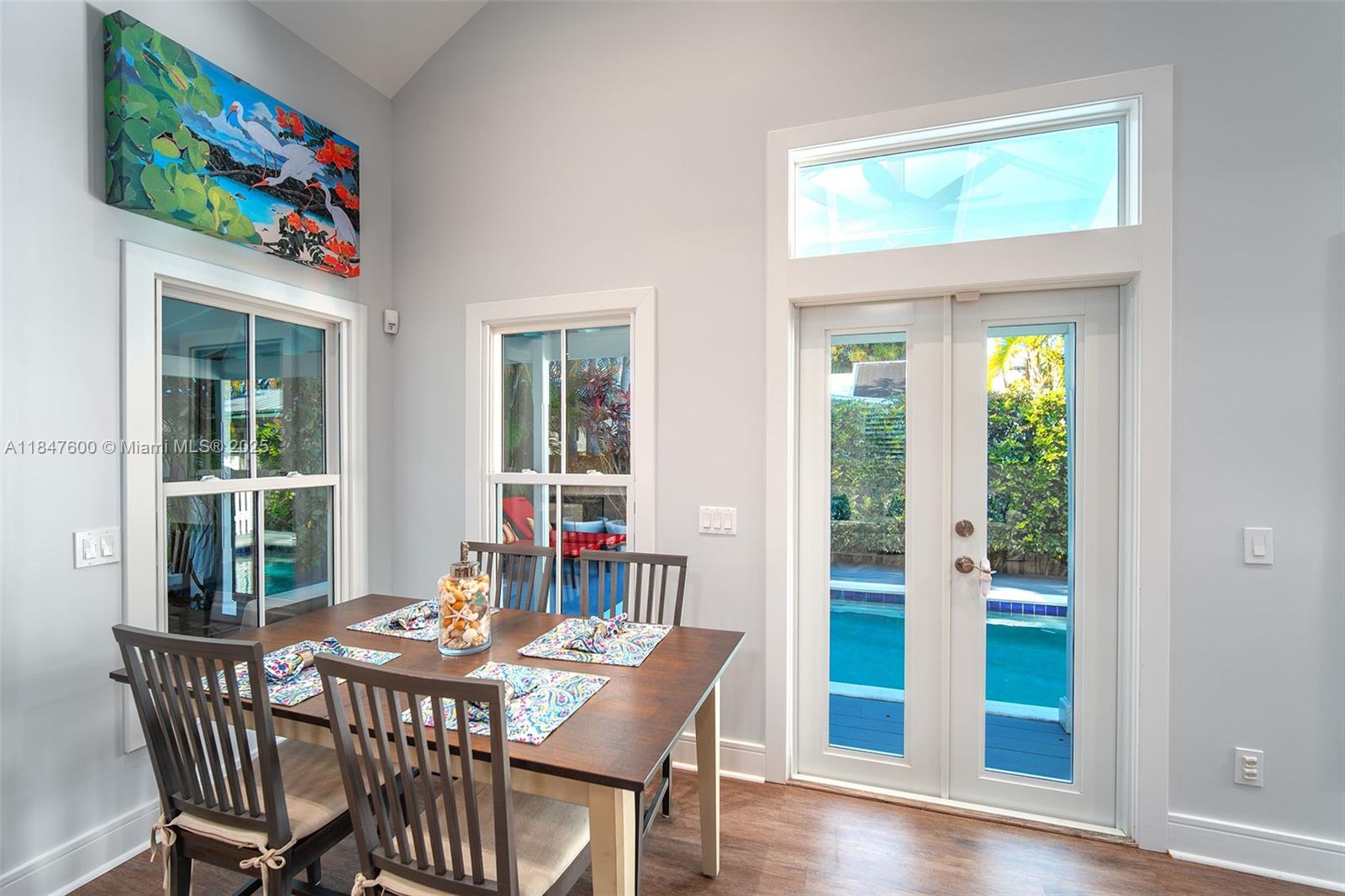 1114 Packer Street Key West, FL 33040 - Photo 46 of 98 a view of a dining room with furniture window and wooden floor