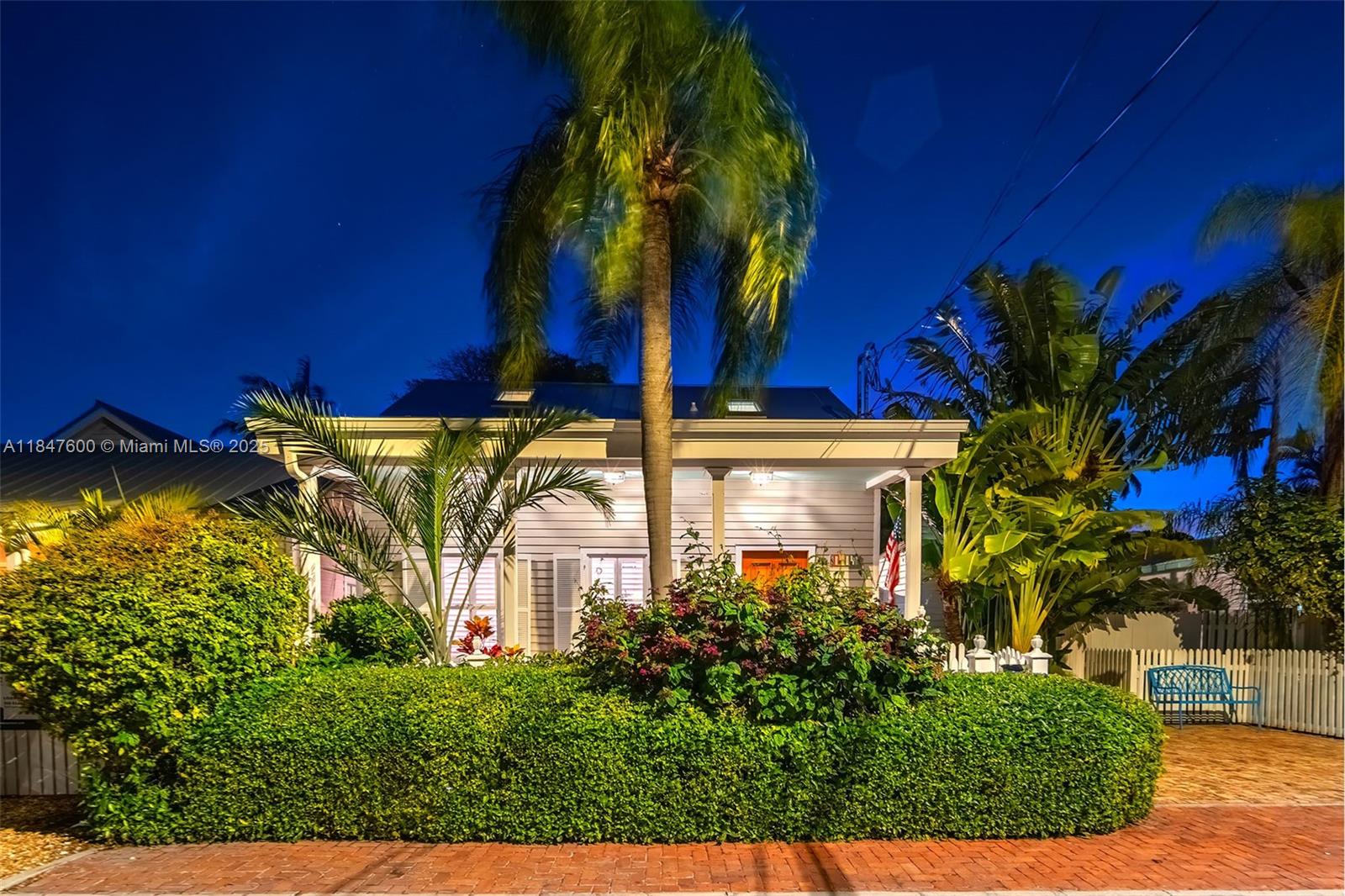 1114 Packer Street Key West, FL 33040 - Photo 59 of 98 a view of a house with fountain and potted plants