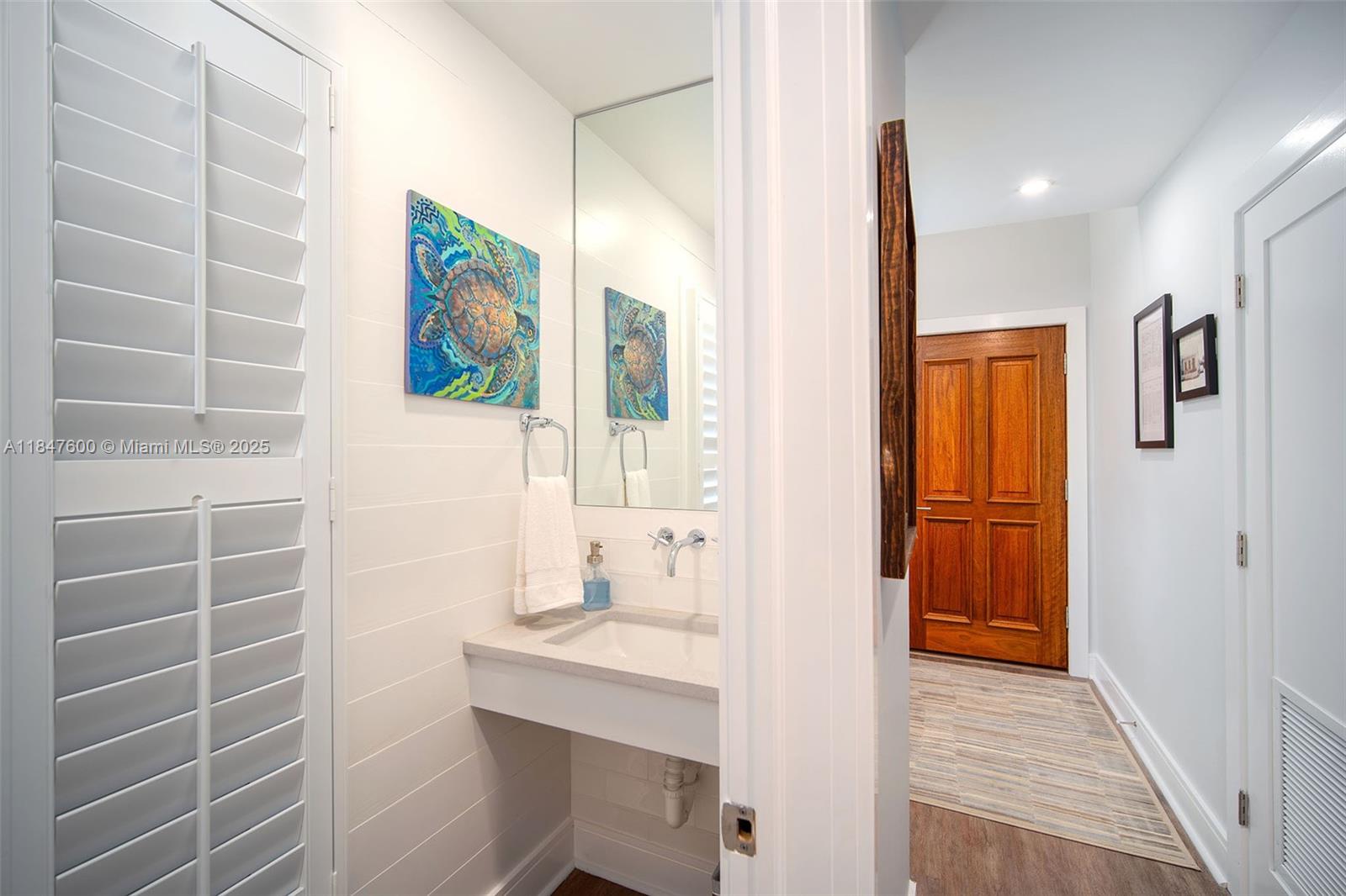 1114 Packer Street Key West, FL 33040 - Photo 81 of 98 a bathroom with a sink a mirror and a shower