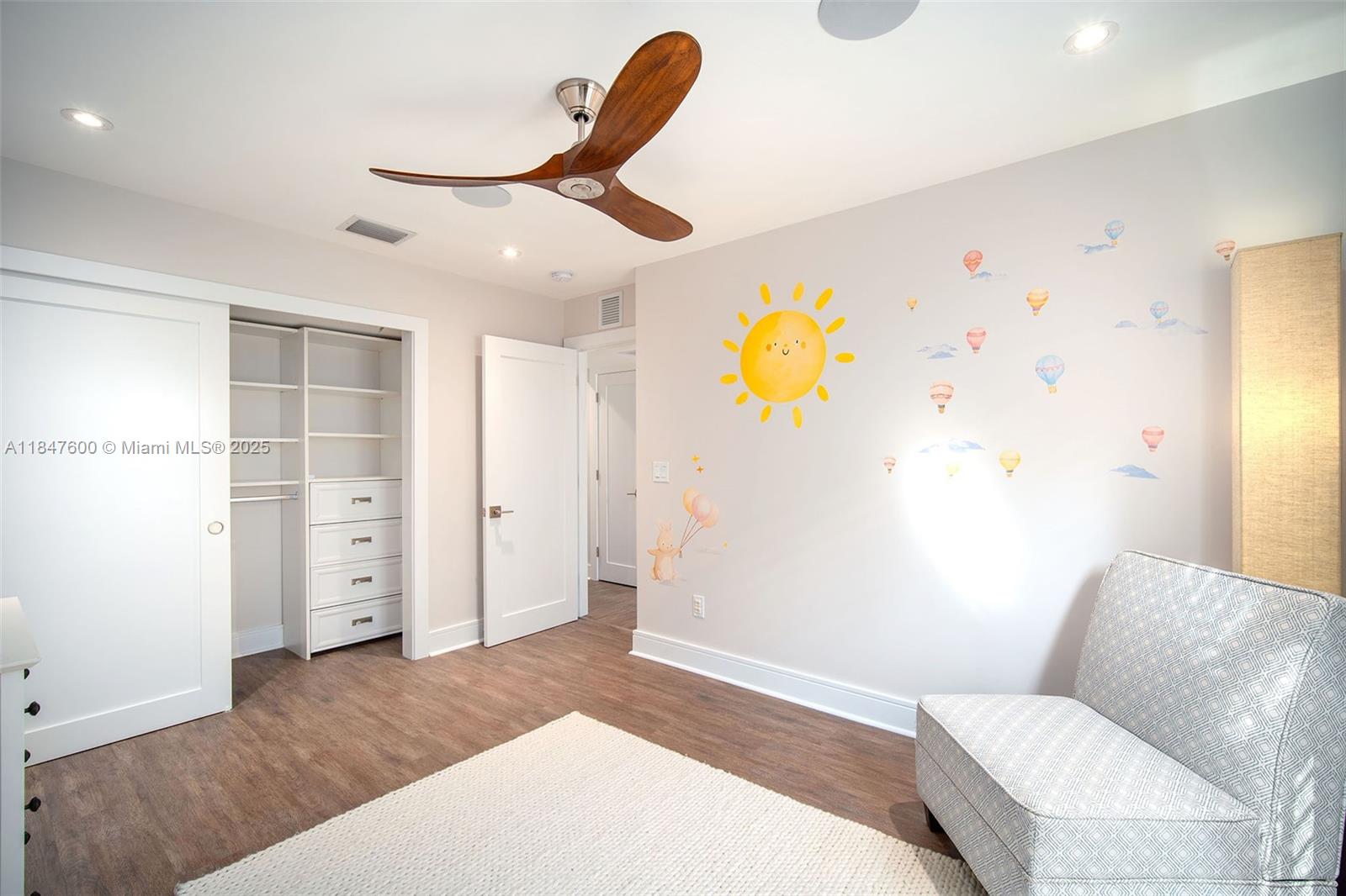 1114 Packer Street Key West, FL 33040 - Photo 84 of 98 a bedroom with a bed and a painting on the wall