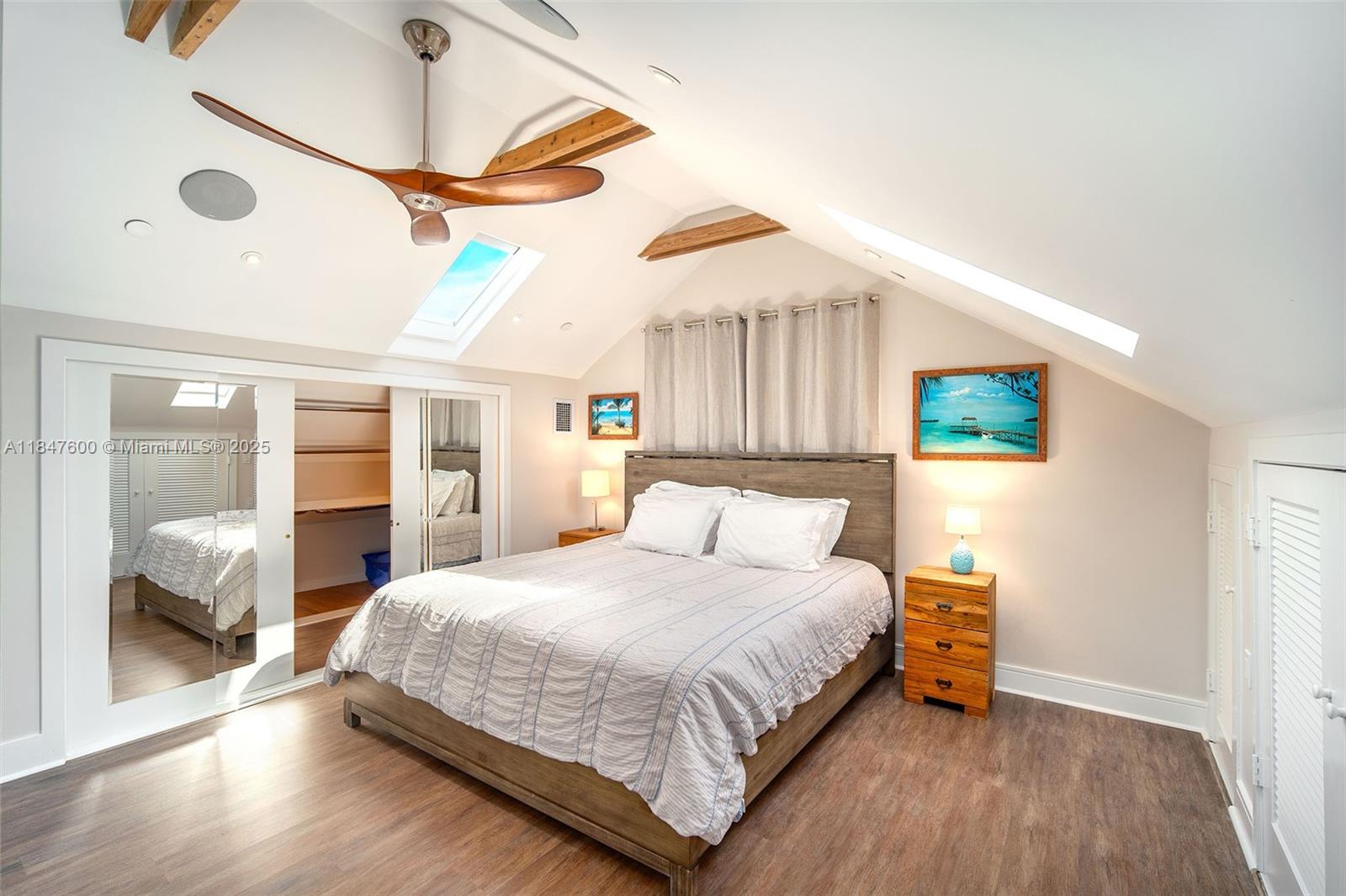 1114 Packer Street Key West, FL 33040 - Photo 88 of 98 a bedroom with a bed and a mirror