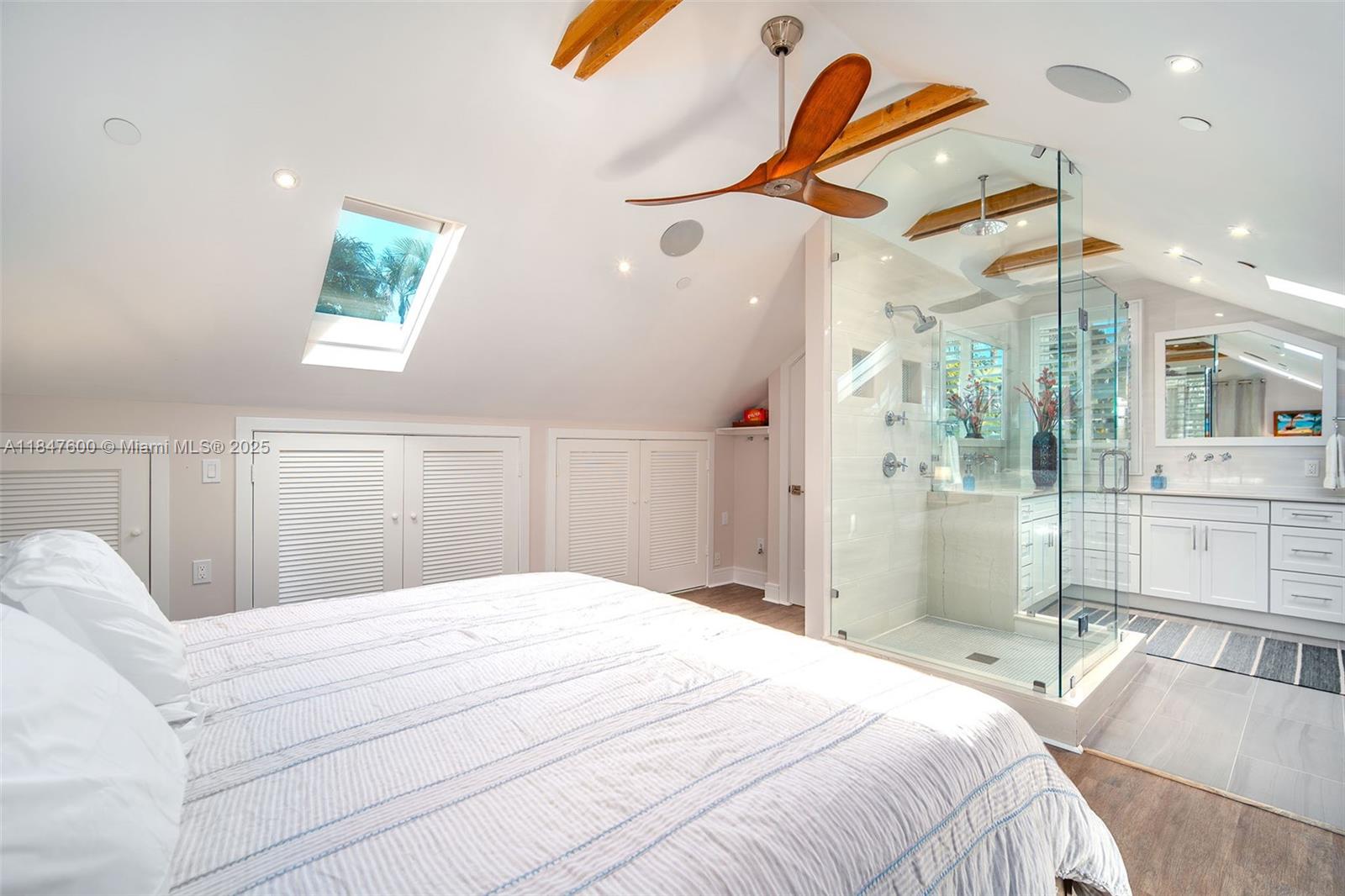 1114 Packer Street Key West, FL 33040 - Photo 93 of 98 a bedroom with a bed and a chandelier