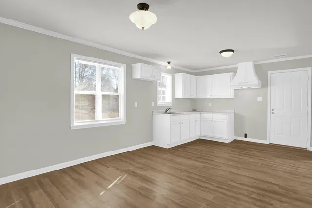 a view of kitchen with wooden floor