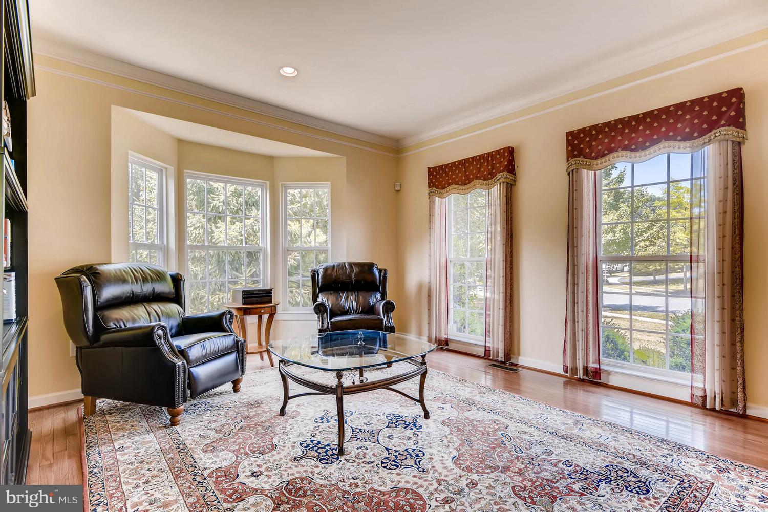 Living Room with bay window & hardwood floors