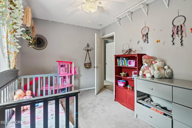 a view of a room with lots of stuff and hardwood floor