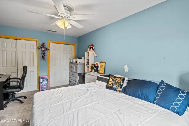 a bed room with a bed and a chandelier