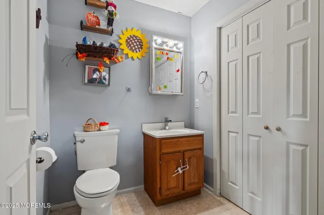 a bathroom with a toilet a sink and a shower