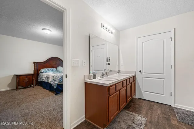 a bathroom with a sink a mirror and a bathtub