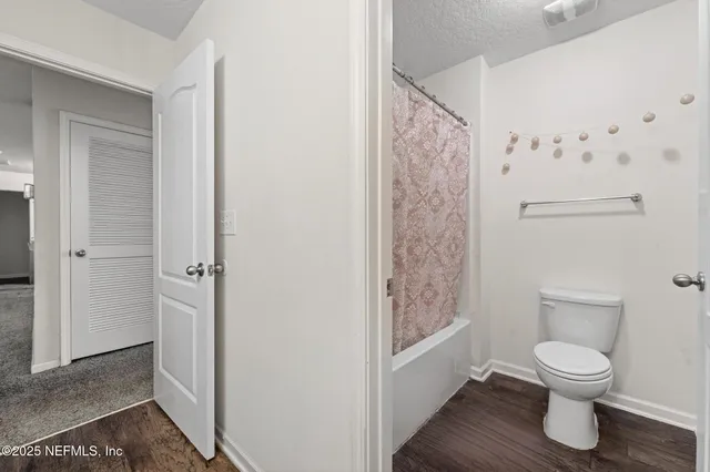 a en suite bathroom with a sink and a mirror