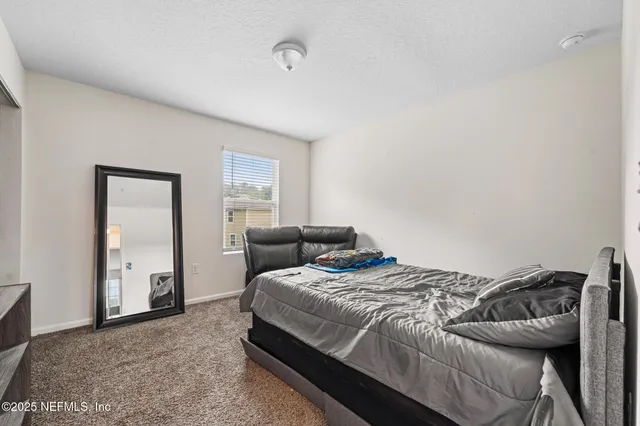 a white toilet sitting next to a shower curtain