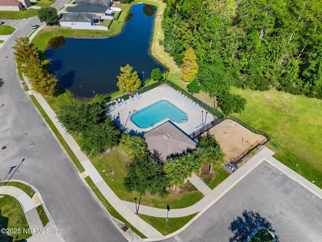 an aerial view of a house with swimming pool