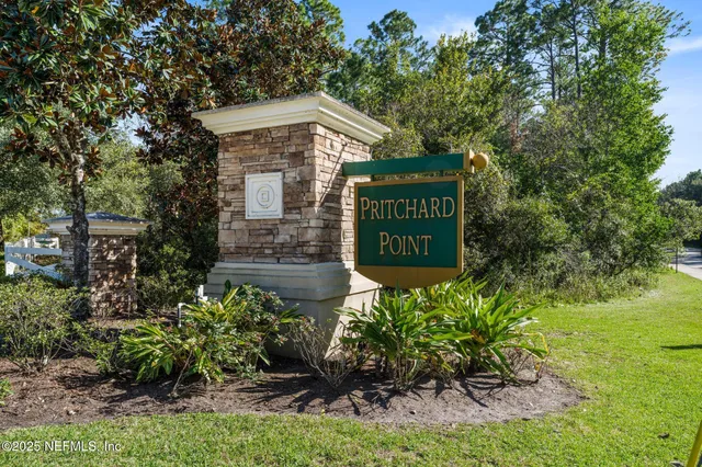 a aerial view of a house with swimming pool garden and patio