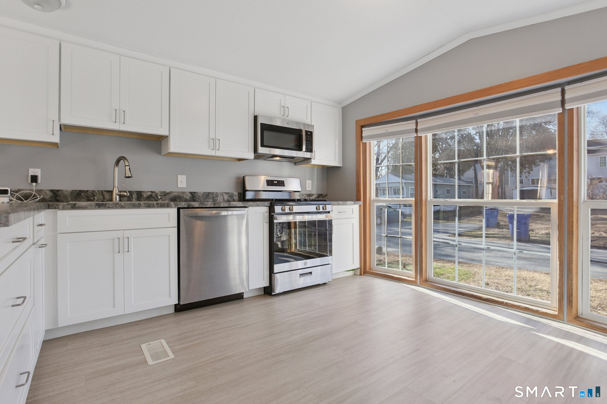 5 Cook Terrace Westbrook, CT 06498 - Photo 7 of 19 For added privacy, the owner had a special film applied to the windows, light comes inside, but you can't see into the unit from the outside!