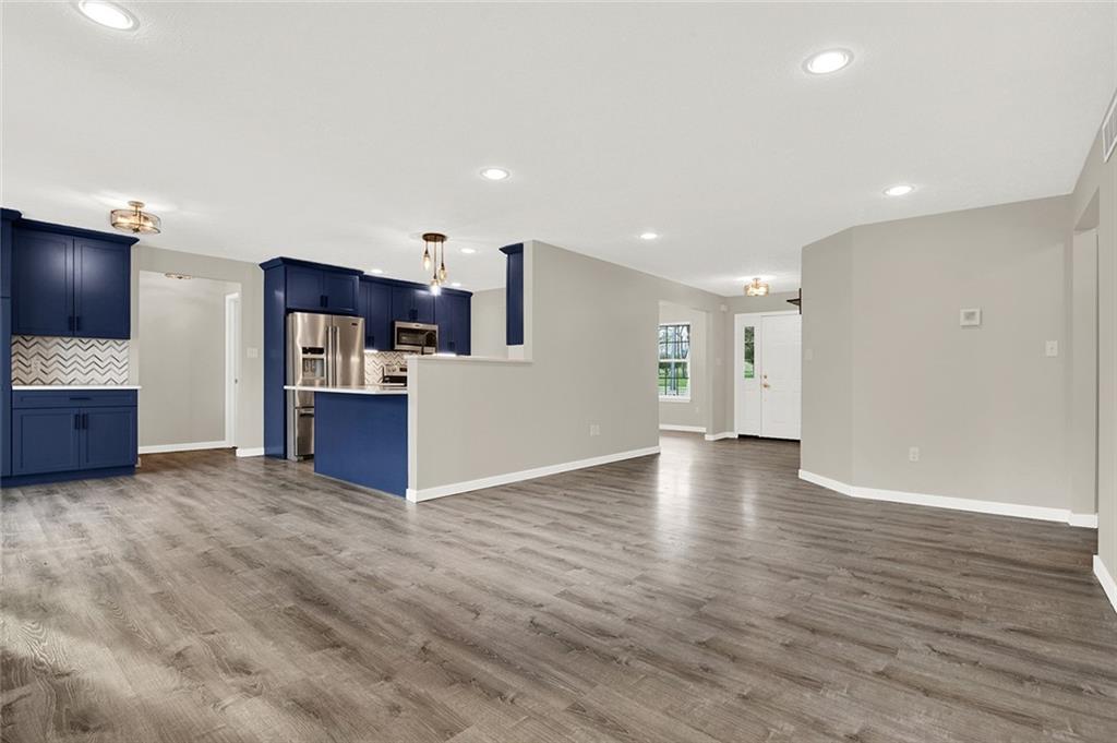667 Old Frame Road Smithfield, PA 15478 - Photo 16 of 38 a view of kitchen and hall with wooden floor