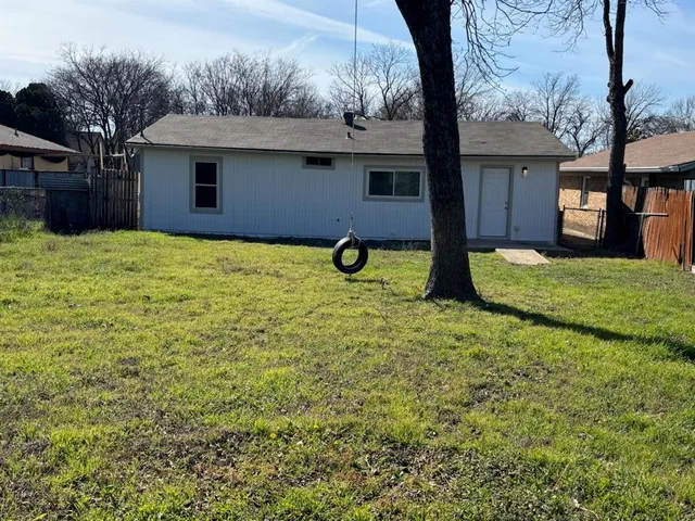 a view of house with yard