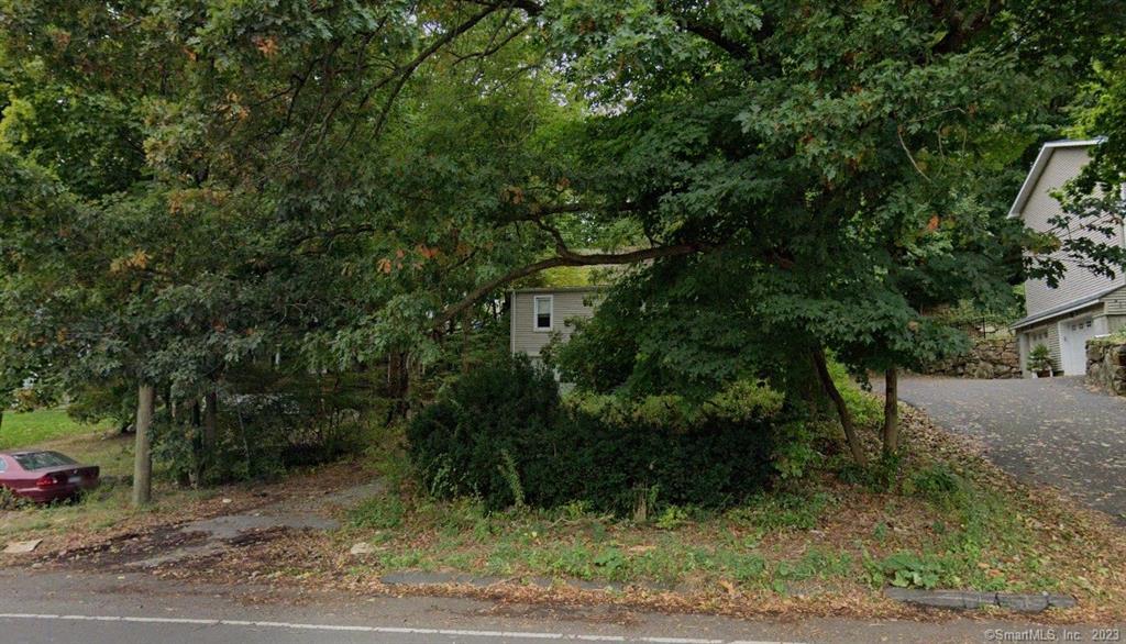 23 Riverside Avenue Norwalk, CT 06850 - Photo 1 of 1 a view of a yard with plants and trees