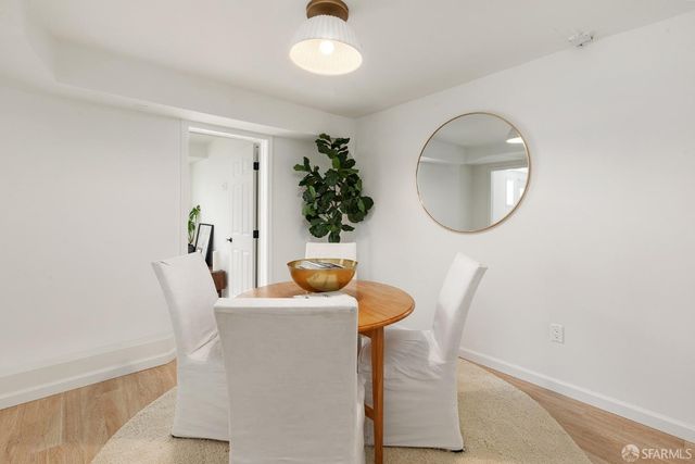 a bathroom with a sink mirror and vanity