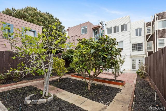 a tree in front of a building
