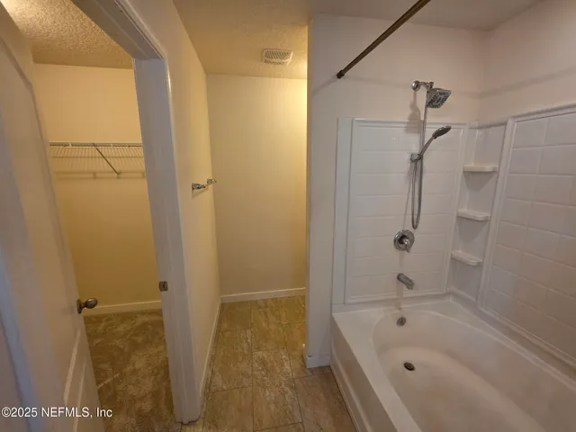 a bathroom with a bathtub