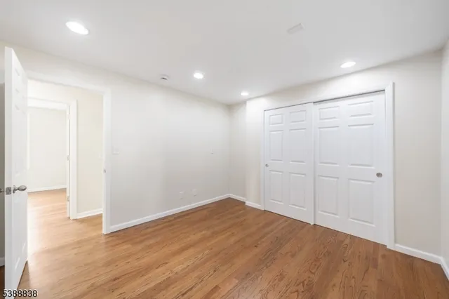 an empty room with wooden floor