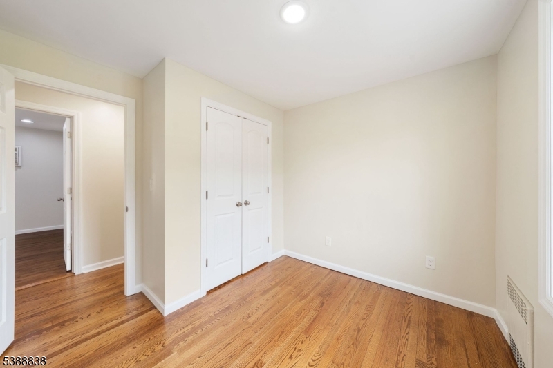 2429 Vauxhall Road Union, NJ 07083 - Photo 14 of 24 wooden floor in an empty room